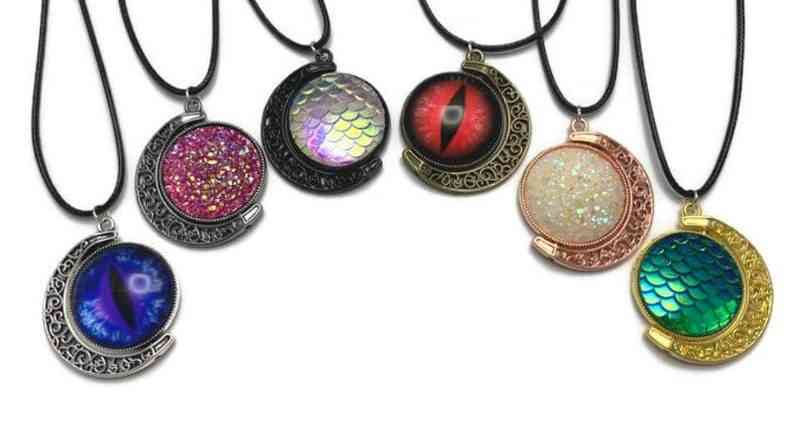 Fidget jewelry: moon spinner necklace with various colorful cabochons.