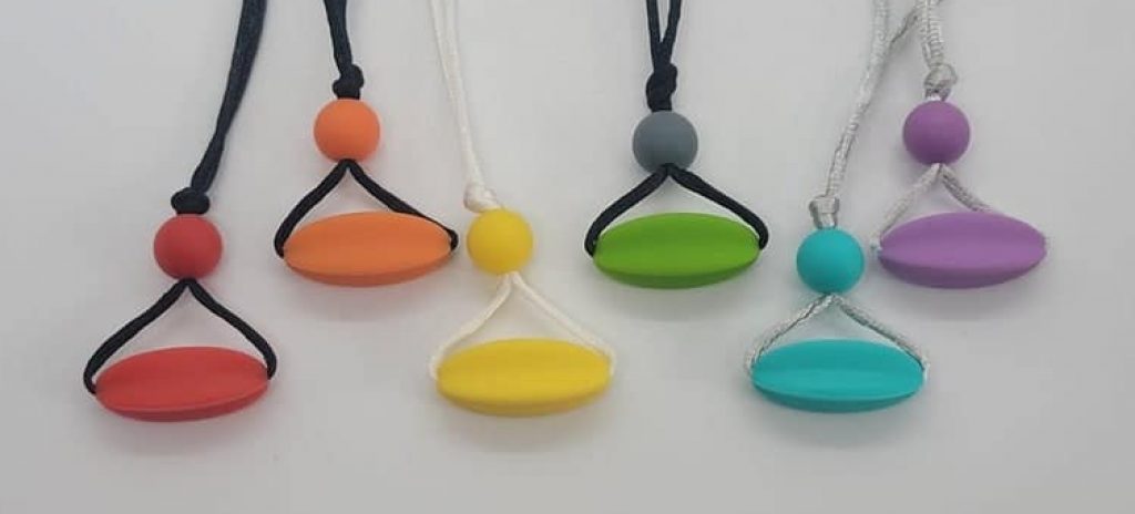 Chewelry sensory silicone pendant in starfruit shape.