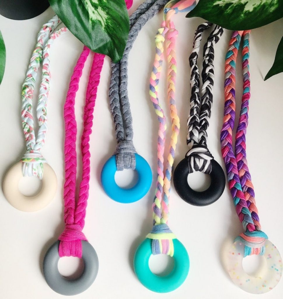 Silicone pendant with chewable braided cotton cord.