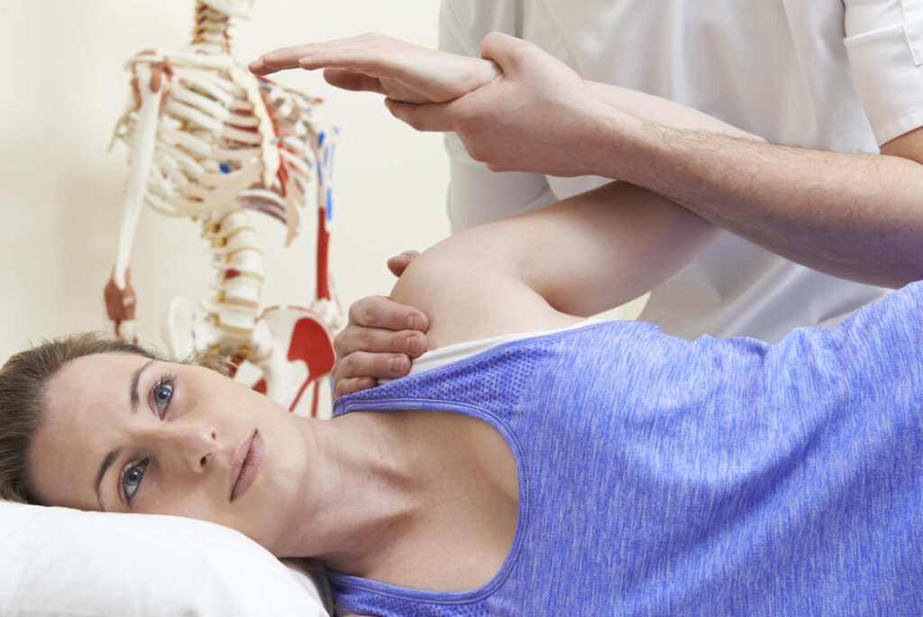 Woman doing physical therapy after shoulder surgery
