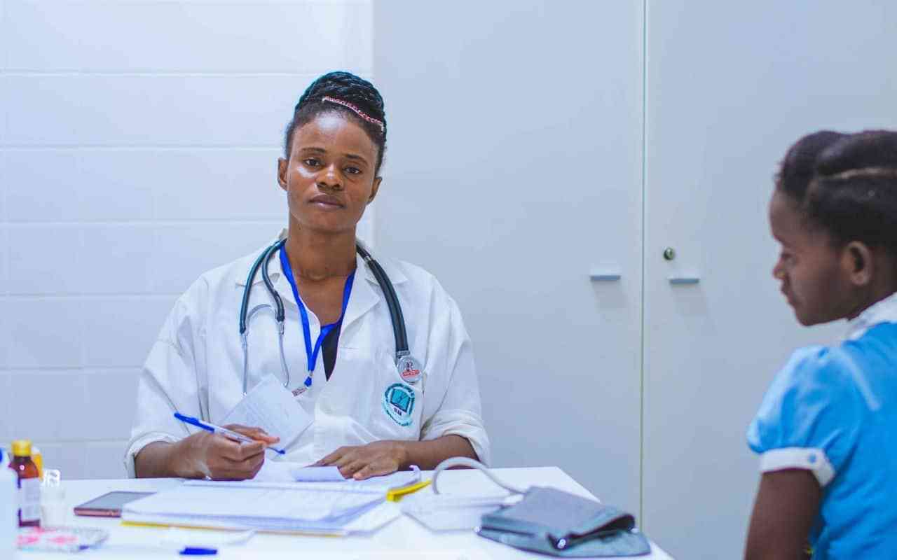 Psychiatric nurse practitioner taking notes in a clinic.