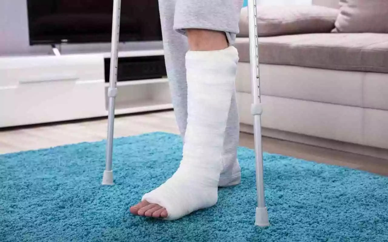 Injured in Colorado -- person with leg in cast and crutches.