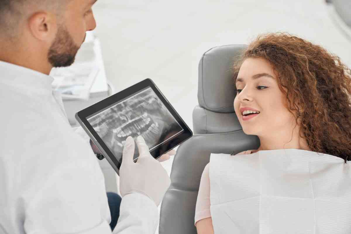 Dentist and child looking at x-rays.