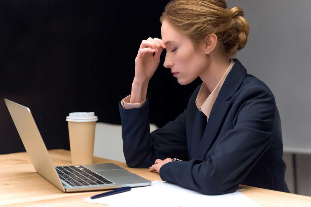 Stressed woman at work in an office.